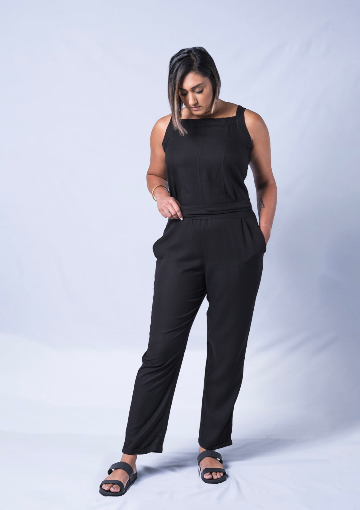 All In One Jumpsuit Model Standing showing waistband. Waistband tied to back