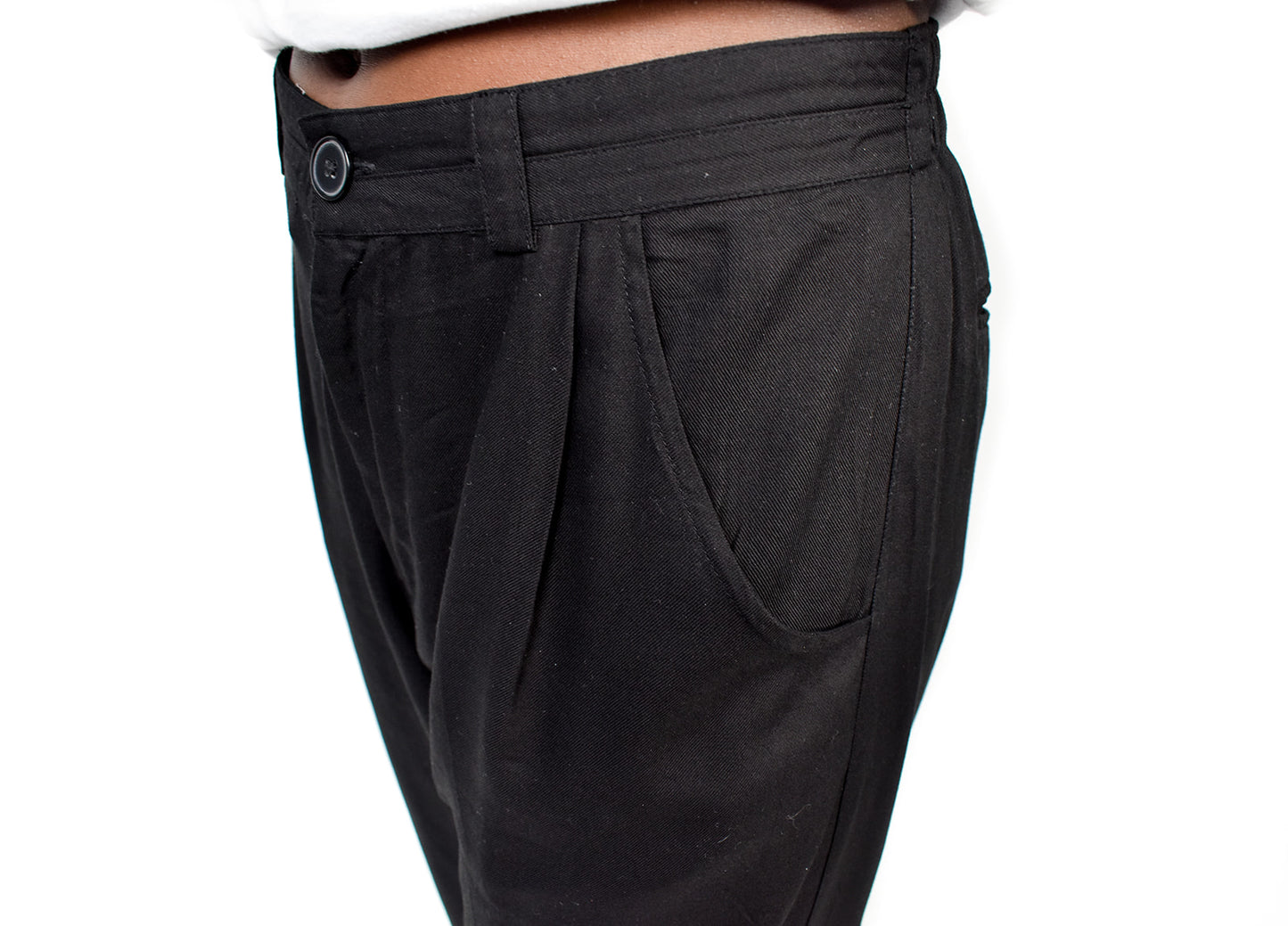 The Jogger Dress pants as crafted with hand-picked lightweight woven viscose fabric. Features deep pockets, button closure and pleats. Sizes XS-XL available.