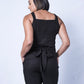 All In One Jumpsuit Model showing back of jumpsuit. Waistband tied to back