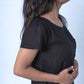 Black T-Shirt Dress side view focus on pleated sleeves