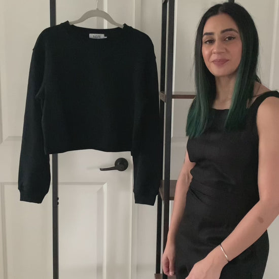 Lets talk about the details of the Crop Crew Neck Sweatshirt. Video detailing how the black Crop Crew Neck Sweatshirt can be worn.